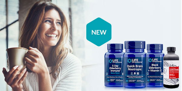 Healthy looking and smiling woman with a cup in her hands and Life Extension supplements displayed on her right